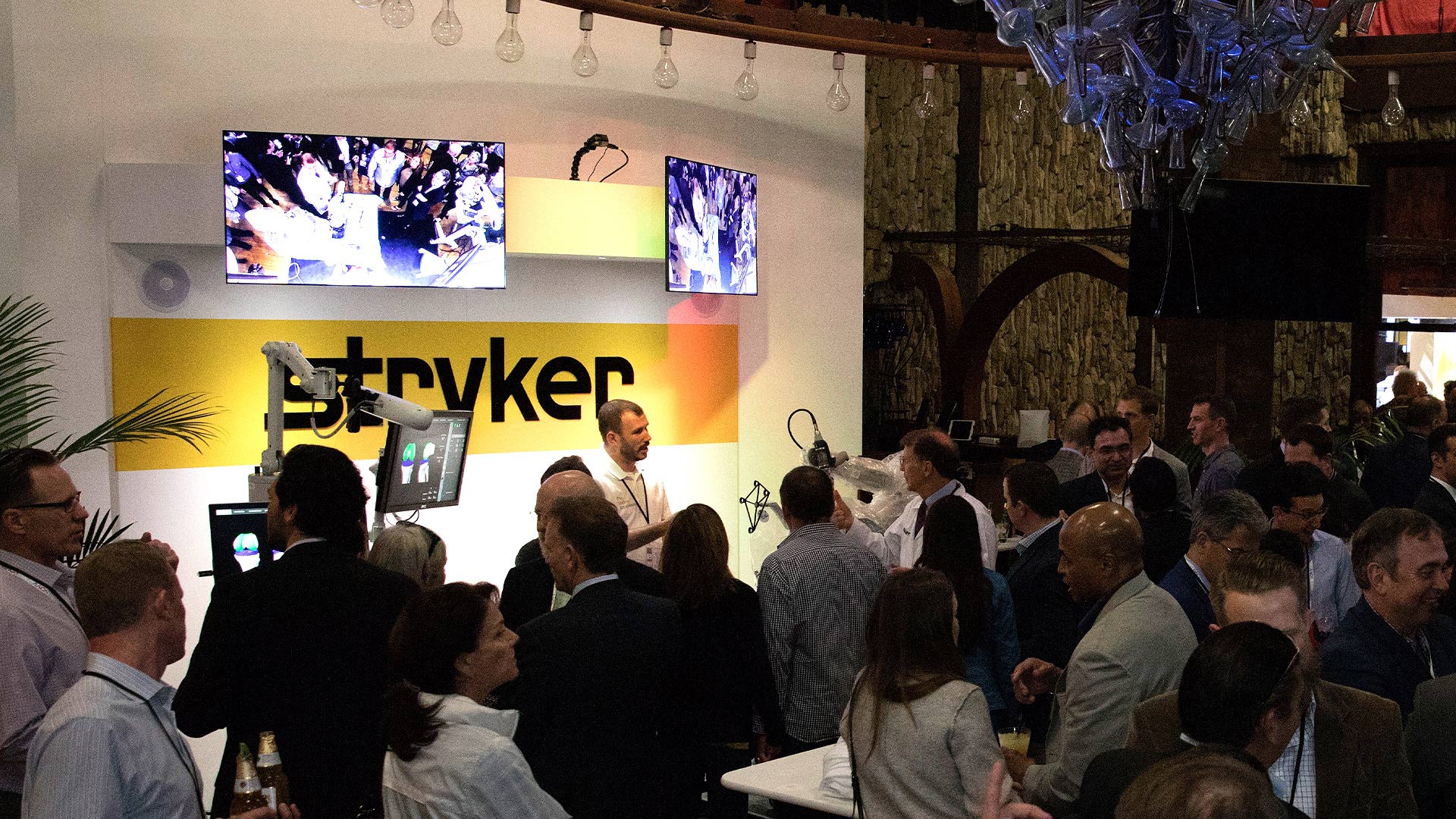 Numerous physicians form a crowd to learn more about Stryker's technologies. 